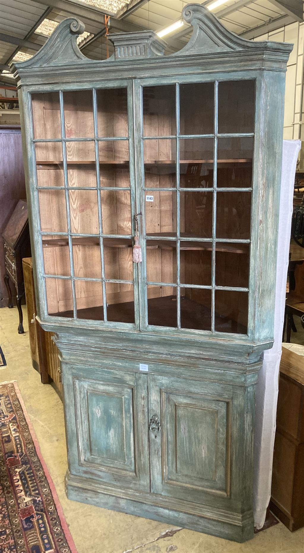 An 18th century style Dutch painted standing corner cabinet, width 112cm depth 60cm height 225cm